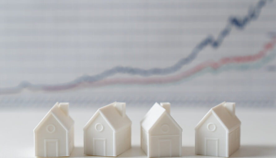 image of decoy houses in front of housing market graph